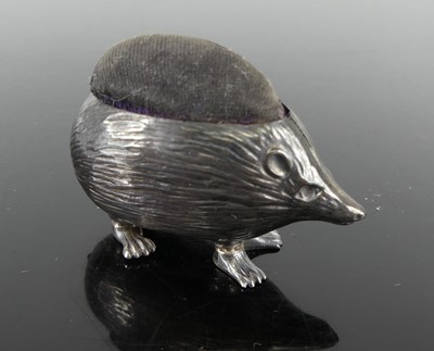 Lot 354 - An Edwardian silver pin cushion in the form of...