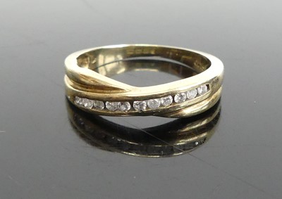 Lot 368 - A modern 9ct gold diamond half hoop ring,...