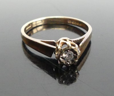 Lot 369 - A modern 9ct gold diamond solitaire ring,...