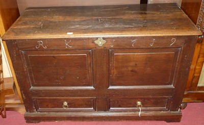 Lot 1332 - An 18th century joined oak mule chest, the...