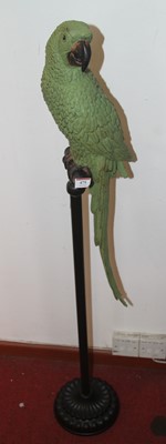 Lot 475 - A composite model of a green parrot on a perch,...