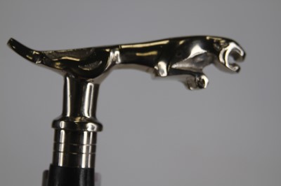 Lot 476 - A walking stick having a reproduction Jaguar...