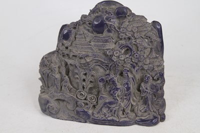 Lot 481 - A carved blue resin model of figures before a...