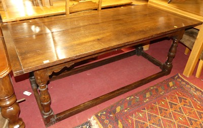 Lot 1374 - A joined oak and elm plank topped refectory...