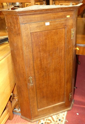 Lot 1386 - An early 19th century oak single door hanging...