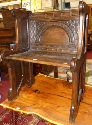 Lot 1398 - A joined oak ecclesiastical single seat pew,...