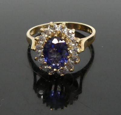 Lot 388 - A modern 9ct gold blue sapphire and CZ set...