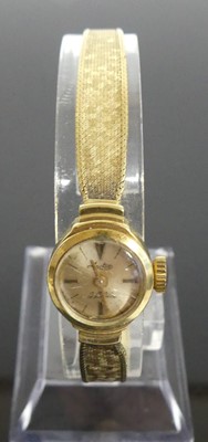 Lot 390 - A lady's Arctos 14ct gold bracelet watch...