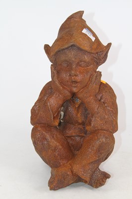 Lot 552 - A rusted metal model of a seated pixie, h.35cm