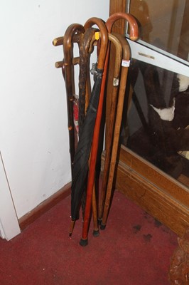 Lot 551 - *A collection of vintage walking sticks and...