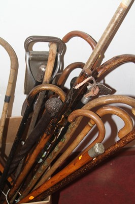 Lot 610 - A collection of vintage walking sticks, to...