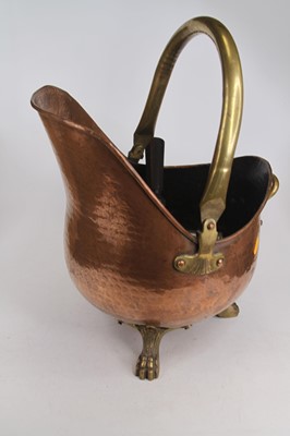 Lot 627 - A Victorian brass and copper coal scuttle;...