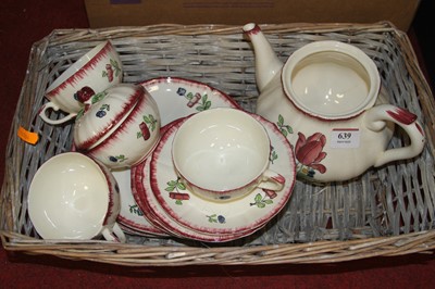 Lot 639 - A floral decorated pottery part tea service