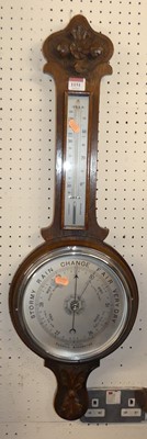 Lot 1151 - An early 20th century oak wheel barometer