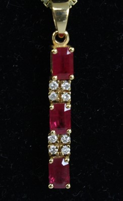 Lot A yellow metal, ruby and diamond articulated...