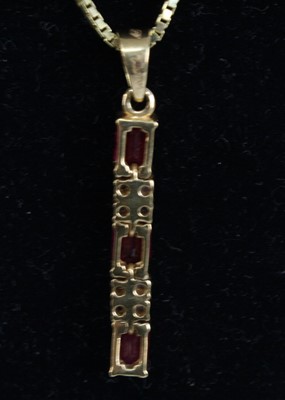 Lot A yellow metal, ruby and diamond articulated...