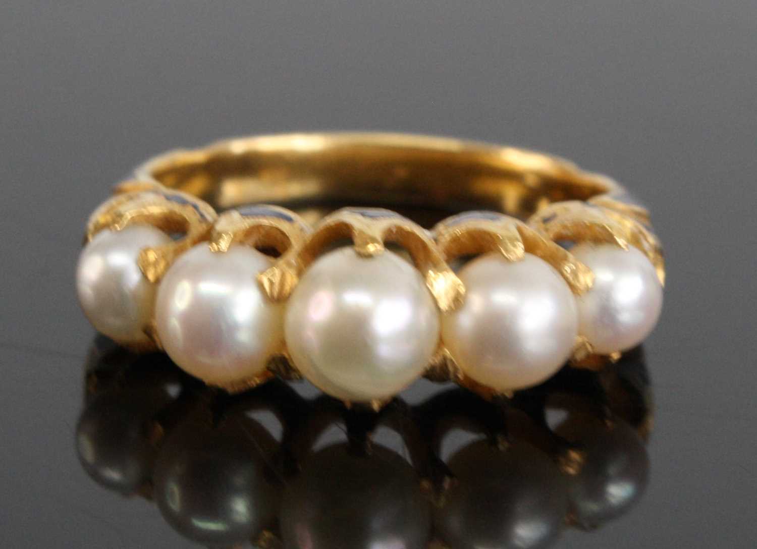 Lot 2525 - A yellow metal pearl half hoop ring,...