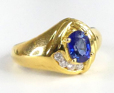 Lot 1300 - An 18ct yellow gold, sapphire and diamond...