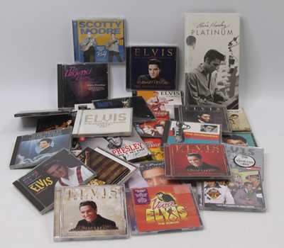Lot 704 - A collection of 30 Elvis Presley music CDs,...