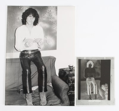 Lot 726 - Jim Morrison, a black and white photograph of...
