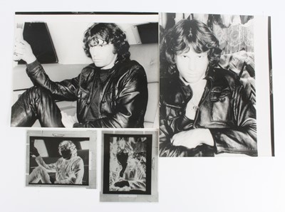 Lot 726 - Jim Morrison, a black and white photograph of...