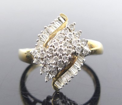 Lot 2615 - A 9ct yellow and white gold diamond navette...