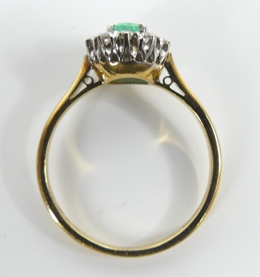 Lot 2632 - A yellow and white metal, emerald and diamond...