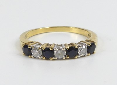 Lot 2669 - A yellow and white metal, sapphire and diamond...