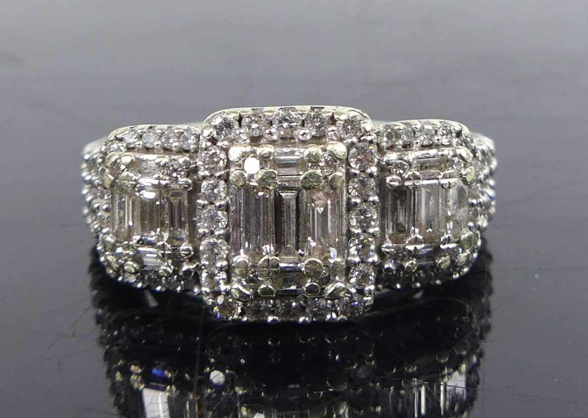 Lot 2670 - A 14ct white gold diamond triple cluster ring,...