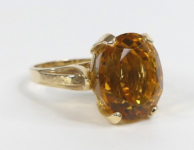 Lot 2672 - A yellow metal citrine single stone ring,...