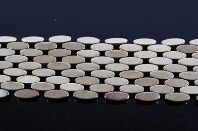 Lot 1243 - A 9ct yellow gold five-row brick link bracelet,...
