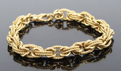 Lot 1240 - An 18ct yellow gold Byzantine link bracelet,...