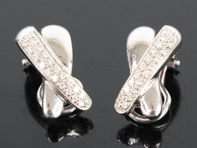 Lot 2712 - A pair of 18ct white gold diamond two-strand...