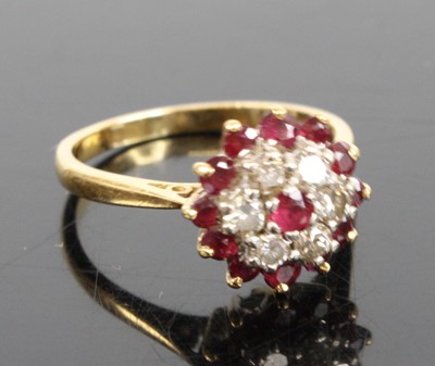 Lot 2221 - An 18ct gold ruby and diamond circular cluster...