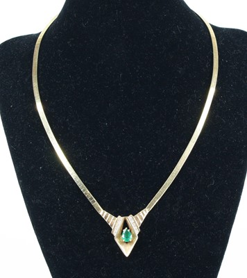Lot 1278 - A 14ct yellow gold emerald and diamond...