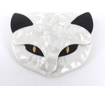 Lot 122 - Lea Stein - a plastic cat face brooch, of...