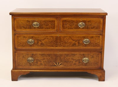 Lot 1533 - A walnut and figured walnut chest in the early...