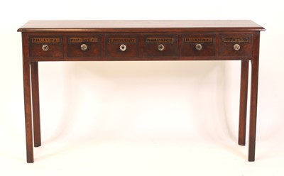 Lot 1540 - An oak apothecary hall table in the Georgian...