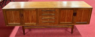 Lot 297 - A 1960s G-Plan 'Fresco' teak long sideboard,...