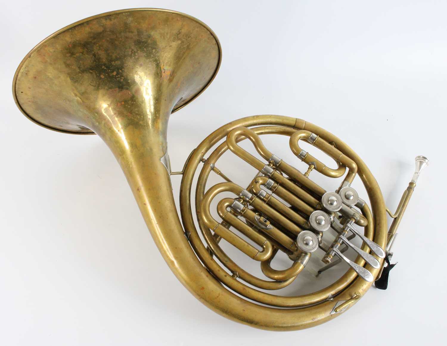 Lot 534 - A 20th century brass French horn, marked KMI...