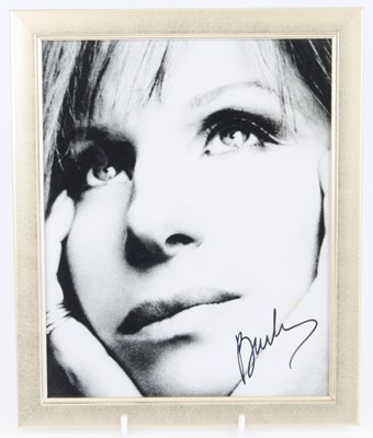 Lot 792 - Barbara Streisand, a black and white portrait...