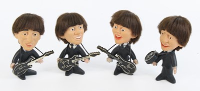 Lot 805 - The Beatles, a set of four plastic figures,...