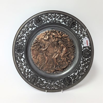 Lot 2 - A copper and pewter charger, repousse...