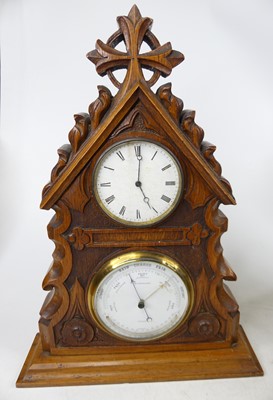 Lot 12 - A Victorian carved oak clock/barometer, h.41cm;...