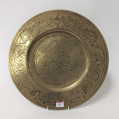 Lot 15 - An Eastern brass charger, etched with dragons,...
