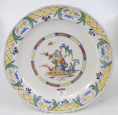 Lot 19 - An 18th century Delft charger, polychrome...
