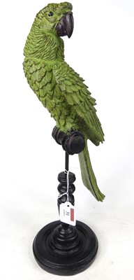 Lot 31 - A model of a green parrot on a perch, h.43cm