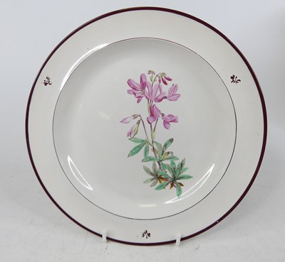 Lot 61 - A Davenport creamware plate, 19th century,...