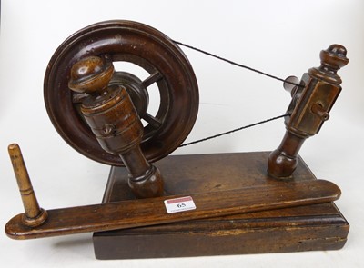 Lot 65 - A 19th century provincial fruitwood spinning...