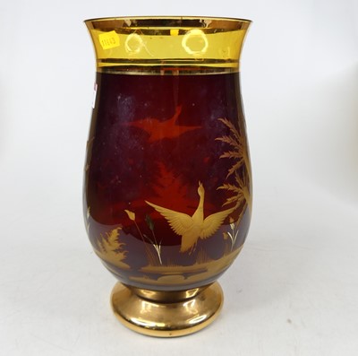 Lot 67 - A 20th century ruby glass vase, of baluster...